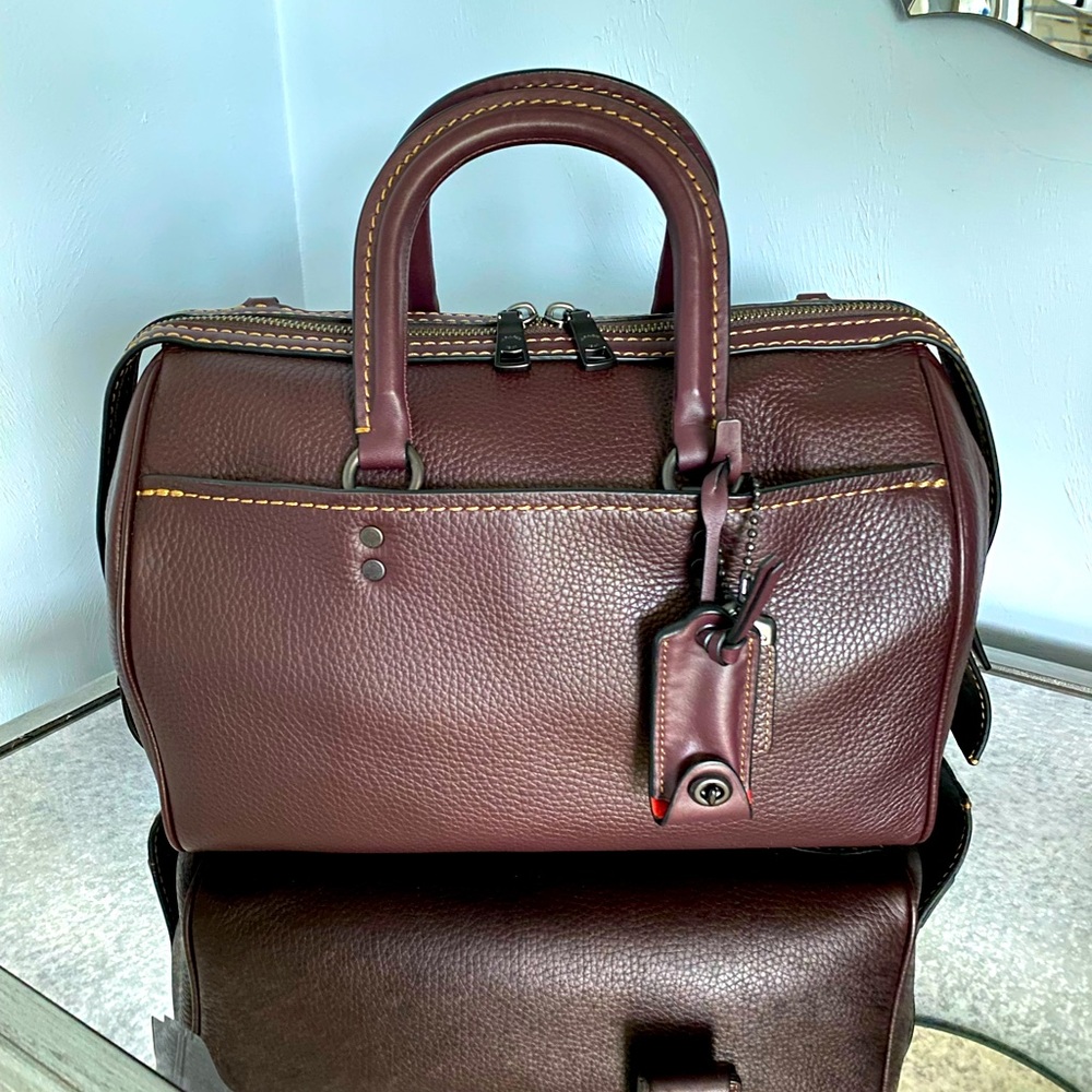 Coach 1941 Rogue satchel in oxblood with red suede interior.